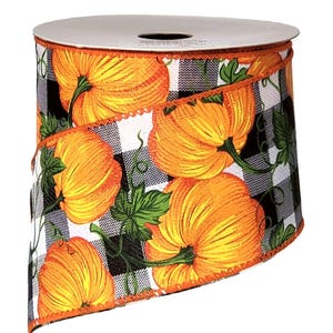 May include: A spool of decorative ribbon featuring a pattern of orange pumpkins with green leaves and vines set against a black and white buffalo check background. The ribbon edges are finished with a thin, bright orange stitched border.