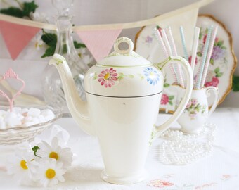 Tall English teapot/ coffee pot: English bone china tea pot decorated with colourful daisies and green swirls, lovely for a tea party.