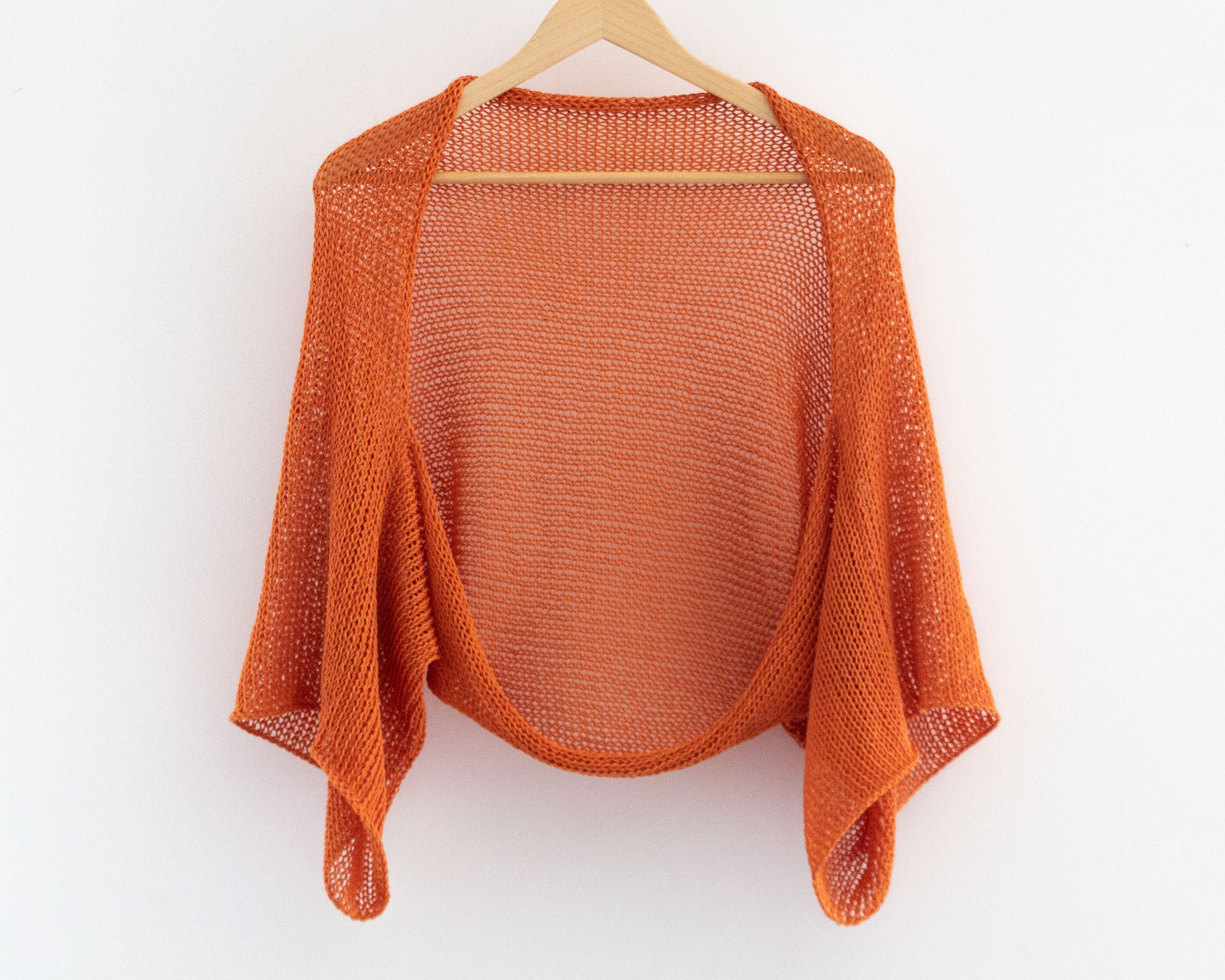 Orange shrug sweater sale