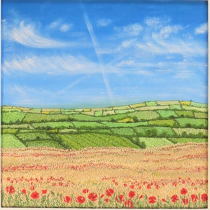 May include: A square painting of a rural landscape. A field of red poppies blooms in the foreground, transitioning to golden wheat. Rolling green fields and hills are under a bright blue sky with wispy clouds and a contrail.