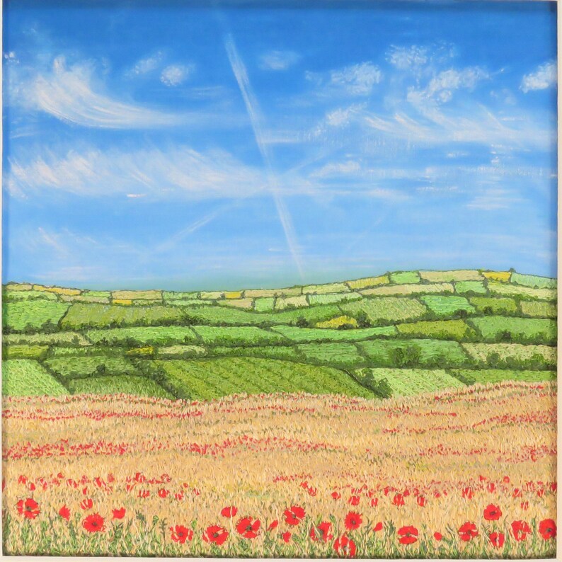May include: A square painting of a rural landscape. A field of red poppies blooms in the foreground, transitioning to golden wheat. Rolling green fields and hills are under a bright blue sky with wispy clouds and a contrail.