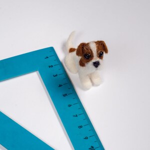 Jack Russell miniature next to a ruler to show scale, needle felted wool dollhouse dog sculpture