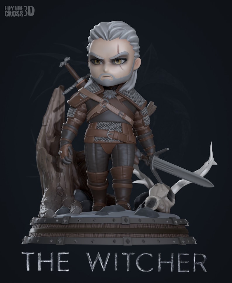 May include: A gray and brown figurine of Geralt of Rivia, a character from the Witcher video game series. The figurine is in a chibi style, with a large head and small body. Geralt is holding a sword in his right hand and has a sword strapped to his back. He is standing on a wooden base with a skull and antlers. The base has the words "The Witcher" written on it.