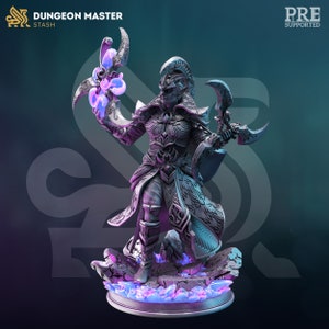 May include: A detailed miniature figurine of a dark-skinned elf wizard holding a glowing orb and a crescent-shaped blade. The figure is wearing ornate armour and robes, standing on a rocky base with glowing blue crystals.