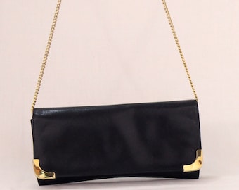 Vintage black leather clutch with golden chain and details