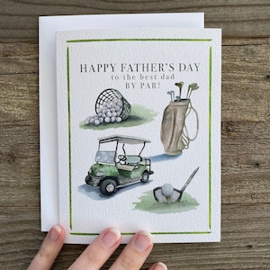 May include: A green and white Father's Day card with a golf theme. The card features a golf cart, golf clubs, golf balls, and the text "Happy Father's Day to the best dad by par!"