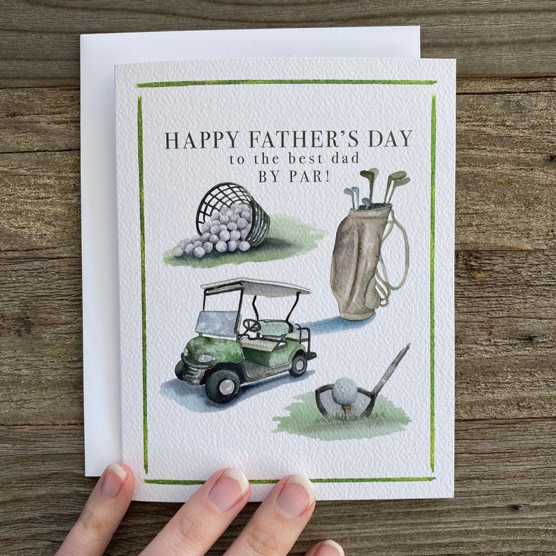 May include: A green and white Father's Day card with a golf theme. The card features a golf cart, golf clubs, golf balls, and the text "Happy Father's Day to the best dad by par!"