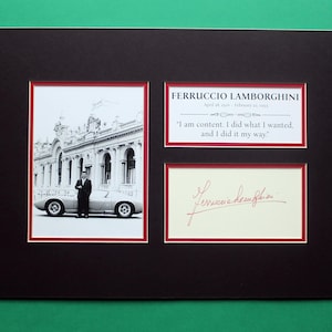 May include: A black matted display featuring a black and white photograph of Ferruccio Lamborghini standing by a sports car, a text plaque with his name and the quote, "I am content. I did what I wanted, and I did it my way," and a signature.