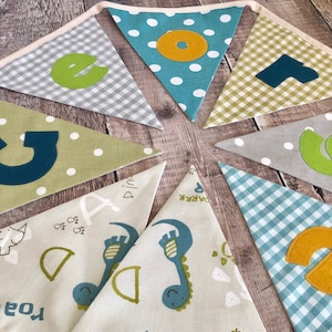 Children&#39;s Dinosaur Bunting with grey, turquoise & green polka dot and gingham flags, matching cushion available