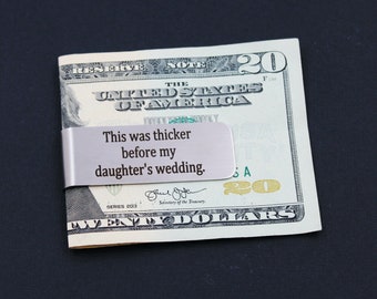 May include: Silver money clip with the engraved text "This was thicker before my daughter's wedding."