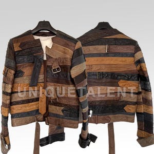 May include: A patchwork leather jacket in shades of brown, black, and tan, with horizontal strips and buckle details. The jacket is displayed on a hanger, showcasing the front and back. The text "UNIQUETALENT" is visible.