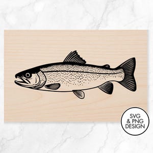 May include: Black and white illustration of a fish, likely a trout, on a light wood background. The fish is detailed with fins, scales, and a dotted pattern. A circular logo in the bottom right corner reads "SVG & PNG DESIGN."