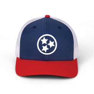 May include: A blue and red baseball cap with a white mesh back. The front of the cap features a white circle with three white stars inside. The circle and stars are the symbol of the state of Tennessee.