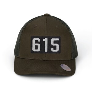May include: A dark green and black trucker hat with a black patch that says "615" in white.