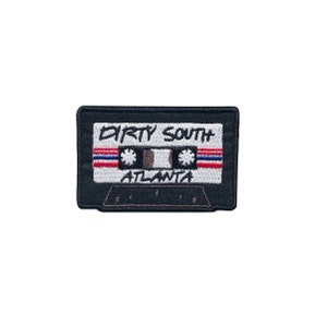 May include: Black and white embroidered cassette tape patch with the text "DIRTY SOUTH ATLANTA".