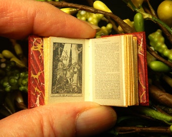 The Crimson Fairy Book: a leather miniature book in 12th scale, hand bound in red with antique illustration of vintage fairy tales.