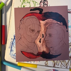 May include: A square artwork featuring two figures within a stylized apple. One figure is a skull-faced character wearing a headset, the other is a man in profile. The apple is red and black, set against a brown background.