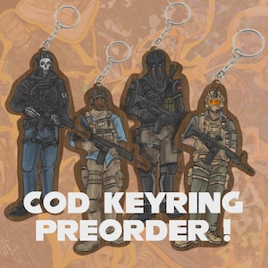 May include: Four keyrings with illustrations of soldiers in tactical gear, each holding a rifle. The keyrings are attached to silver metal rings. The text "COD KEYRING PREORDER!" is displayed in white block letters.