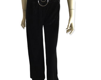 May include: Black velvet wide-leg pants with a silver ring belt.