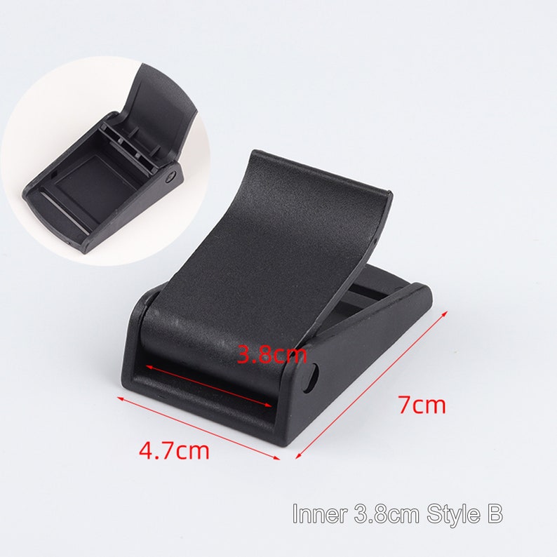 May include: Black plastic buckle with a 3.8 cm inner width. The buckle is 7 cm long and 4.7 cm wide.  Inner 3.8cm Style B.