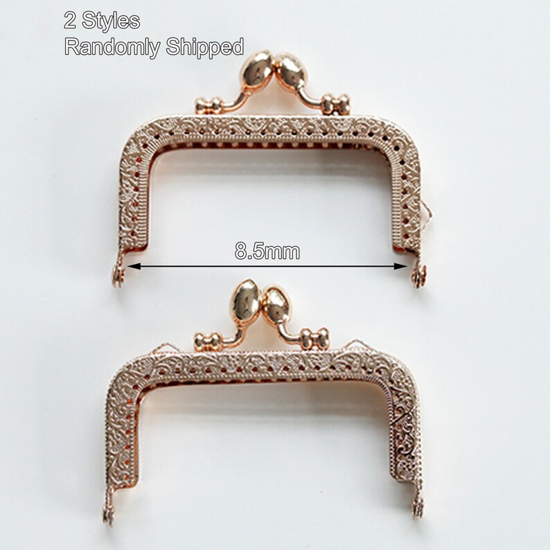 May include: Two gold-toned metal purse frames with ornate designs. Each frame measures 8.5 mm wide. 2 Styles Randomly Shipped.