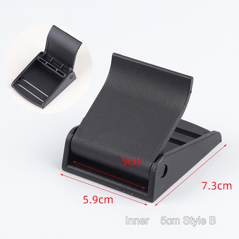 May include: Black plastic buckle for a 5 cm strap. The buckle measures 5.9 cm wide, 7.3 cm long, and 5 cm high.  Inner 5cm Style B.