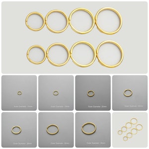 Pode incluir: Conjunto de argolas de salto douradas em vários tamanhos, que vão de 12 mm a 35 mm de diâmetro externo. Essas argolas de salto são ideais para a fabricação de joias, artesanato e projetos de bricolage.