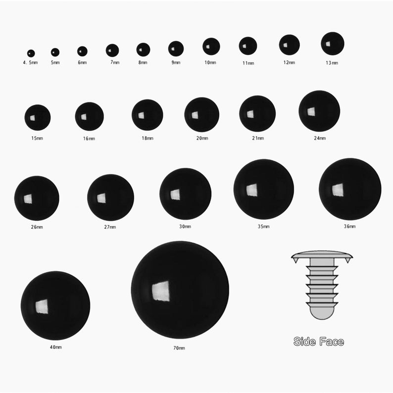 May include: Assortment of black plastic safety eyes in various sizes, ranging from 4.5mm to 70mm. The eyes are glossy and have a reflective surface. A side view of a plastic eye socket is also shown.