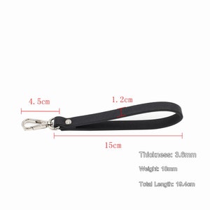 May include: Black leather strap with a silver hook and a total length of 19.4 cm. The strap is 1.2 cm wide and 3.6 mm thick.