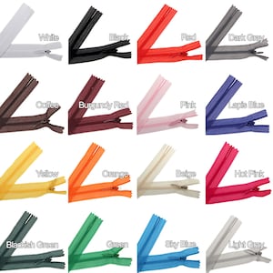 May include: A collection of 16 different coloured zippers, each with a metal slider. The colours include white, black, red, dark grey, coffee, burgundy red, pink, lapis blue, yellow, orange, beige, hot pink, blackish green, green, sky blue, and light grey.