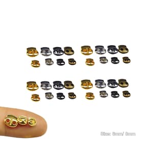 May include: A collection of cord locks in various metallic finishes, including gold, silver, and black. The image shows multiple sizes and styles of cord locks, with the text "Size: 6mm/ 8mm".