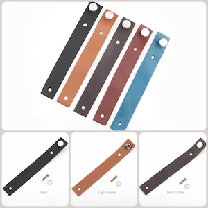 May include: Five leather drawer pulls in different colors: black, light brown, dark brown, red, and blue. Each pull has a silver metal knob and a hole for a screw.