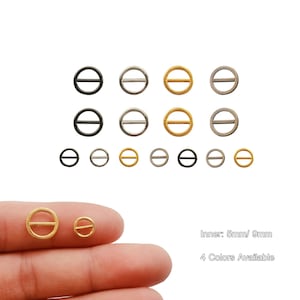 Puede incluir: Surtido de 12 anillos metálicos con una barra en el centro. Los anillos están disponibles en cuatro colores: negro, plata, oro y plata más claro. Los anillos tienen un diámetro de 5 mm y 9 mm.  Interior: 5 mm/9 mm 4 colores disponibles