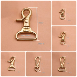May include: Six different styles of gold metal swivel clasps. The clasps are shown with measurements in inches. The clasps are all closed.