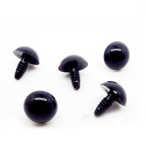 May include: Five black plastic safety eyes with a screw back. The eyes are round and have a shiny finish.