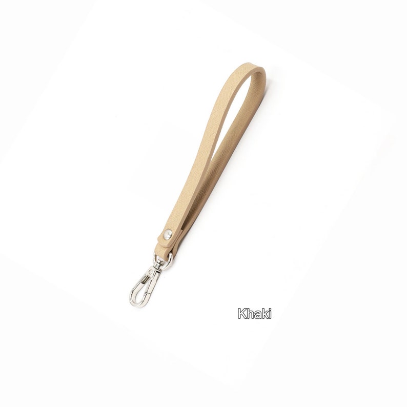 May include: A khaki leather strap with a silver swivel clasp.