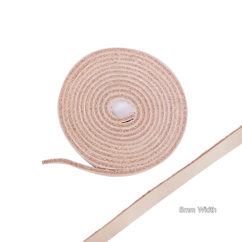 May include: A roll of light brown leather cord, 5mm wide, unfurling to show the length of the cord.