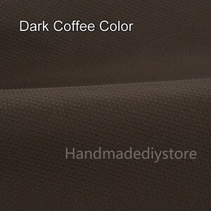 May include: Close-up of a dark brown fabric with a textured surface. The fabric has a subtle pattern of small dots. The text "Dark Coffee Color" is visible in the image.
