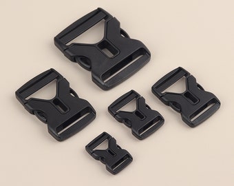 May include: Five black plastic side release buckles of varying sizes. The buckles are designed for use with webbing or straps.