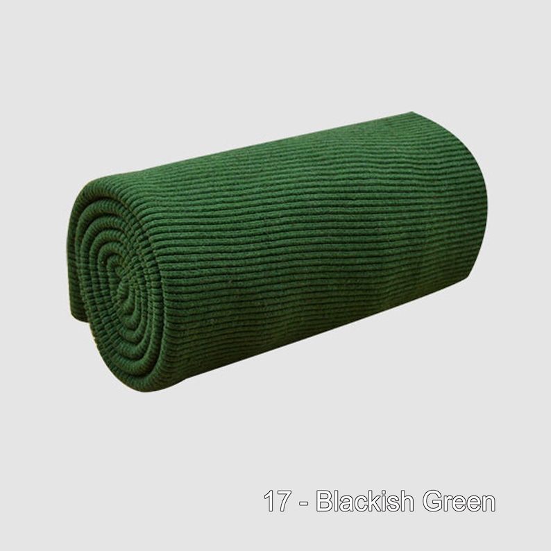 May include: A roll of dark green ribbed fabric. 17 - Blackish Green