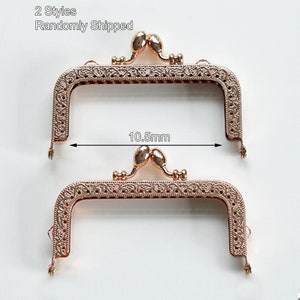 May include: Two gold-toned metal purse frames with ornate designs. The frames are 10.5 mm wide.