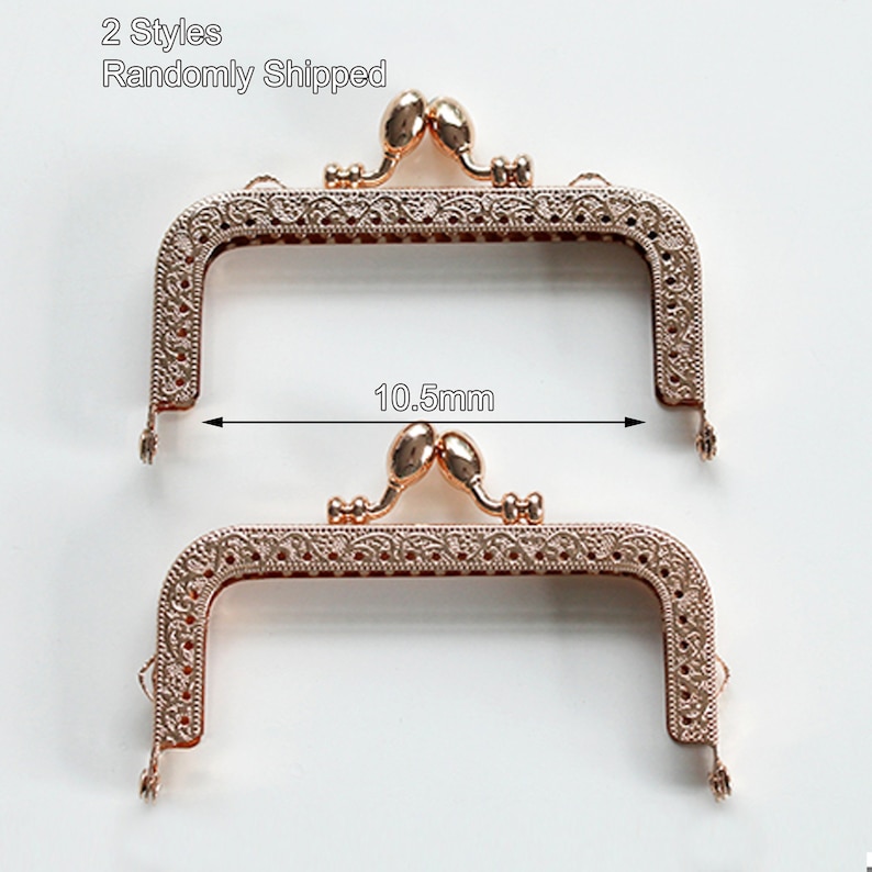 May include: Two gold-toned metal purse frames with ornate designs. The frames are 10.5 mm wide.