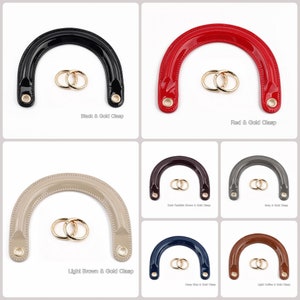 May include: Ten different colors of handbag handles with gold clasps. The handles are made of a glossy material and are shaped like a horseshoe. The colors are black, red, light brown, dark reddish brown, gray, deep blue, light coffee, and white.