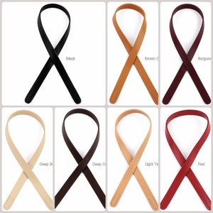 May include: Eight leather straps in different colors, including black, brown, burgundy, deep brown, deep cream, light tan, and red. The straps are all the same size and shape, and they are all folded in half to create a loop.