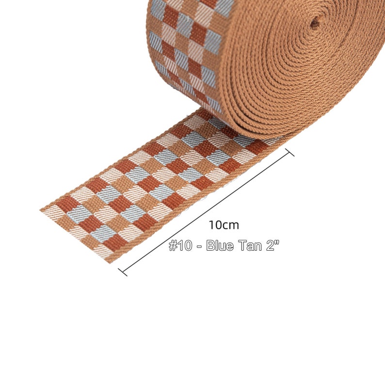 May include: A 10cm (4 inch) wide tan and blue checkered webbing strap. The strap is labeled "#10 - Blue Tan 2"