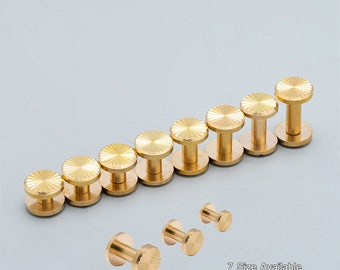 May include: A set of seven gold-toned metal rivets with a starburst design. The rivets are arranged in order of size, with the largest rivet at the top and the smallest rivet at the bottom. The text "7 Size Available" is visible at the bottom of the image.