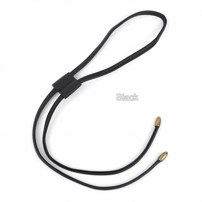 May include: Black leather cord necklace with gold-toned metal tips. "Black" is written in white text on a white background.