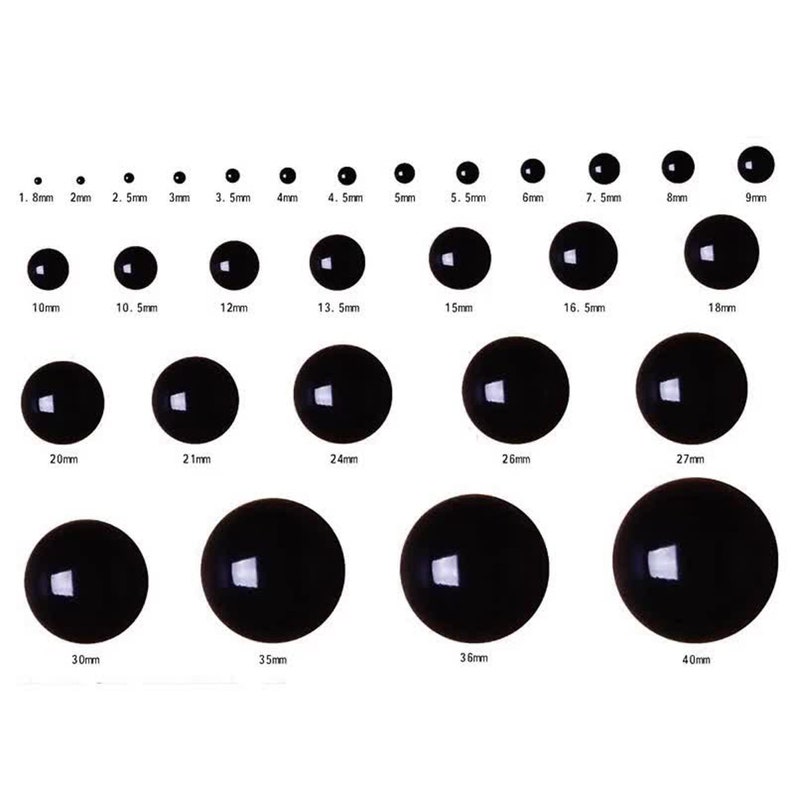 May include: Assortment of black plastic googly eyes in various sizes, ranging from 1.8mm to 40mm.  The eyes are arranged in rows, with the smallest eyes at the top and the largest eyes at the bottom.