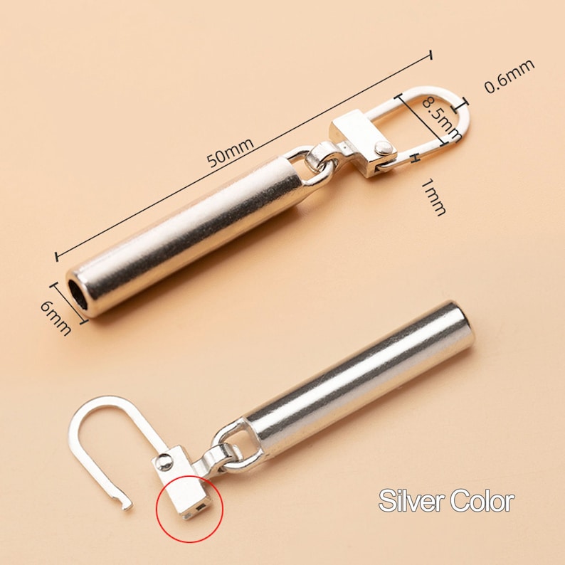 May include: Silver-toned metal connector with a 5 cm long tube and a 0.8 cm loop. The connector has a 1 cm long hook and a 0.6 cm wide opening. Silver Color.