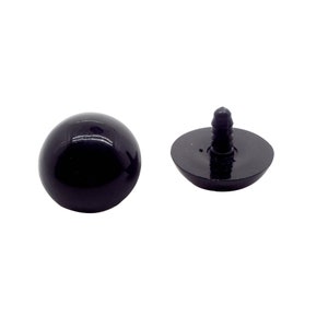May include: A pair of black plastic safety eyes with a screw-on back. The eyes are round and have a glossy finish.